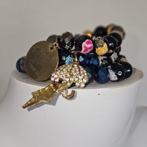 Gold and Black Beaded Bracelet with Charms